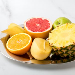 A set of vitamin C fruits on a tray