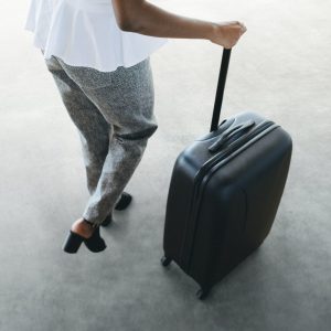 Businesswoman with hand luggage